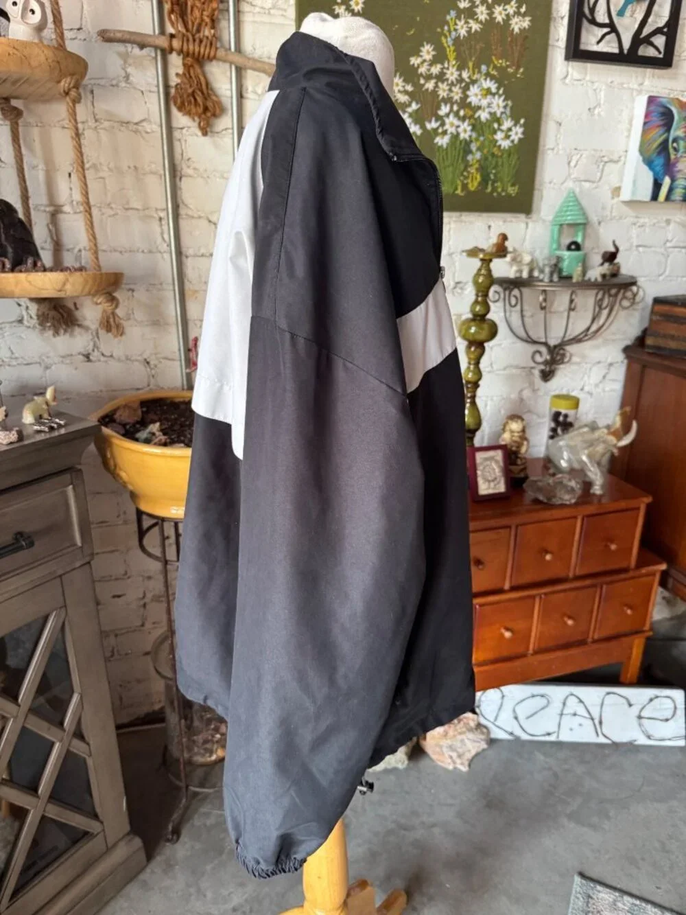 vintage Champion windbreaker jacket featuring a black body with a white chest st